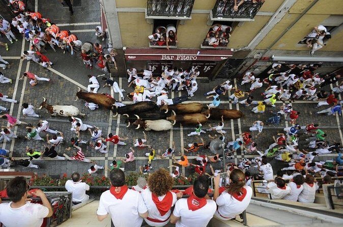 Private Pamplona SAN FERMIN & Bull Run Pick up from San Sebastian - After the run: walking Corrales to the bullring plus churros timing