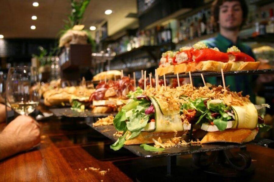 San Sebastian: Walking Tour with Pintxo and Drink - Mercado de la Bretxa and the everyday food vibe